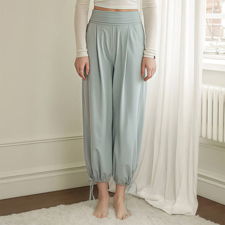 Pantaloni harem da yoga da donna Olivenorma a vita alta, plissettati e con coulisse alla caviglia. - image 1