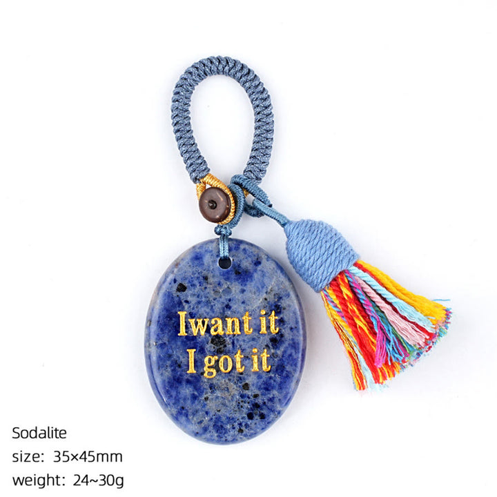 Olivenorma "Lo voglio, l'ho ottenuto" Pietra antistress con nappa in pietra naturale incisa - Sodalite - image 16