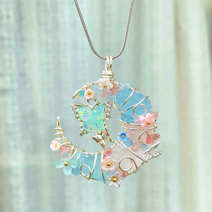 Collana Olivenorma con acquamarina blu, quarzo rosa, mezzaluna, farfalla e fiori - image 1