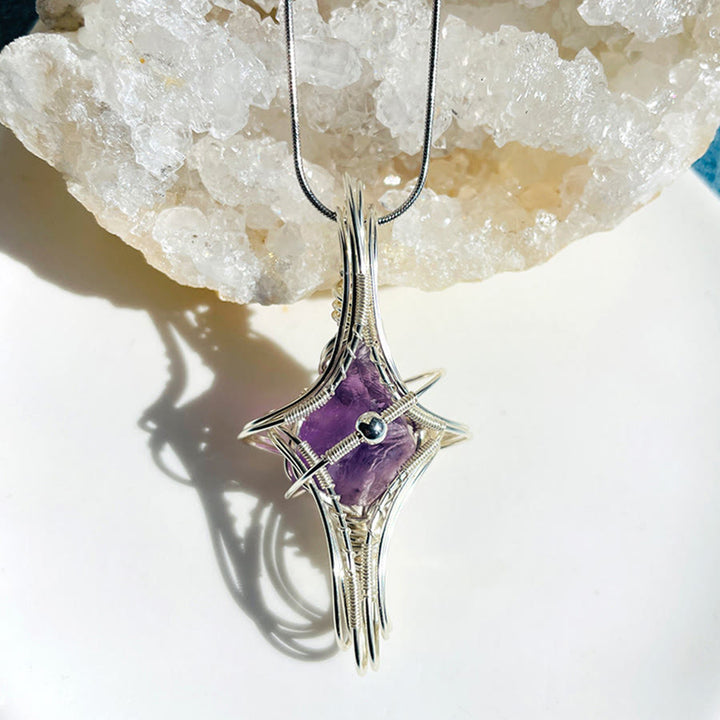 Collana Olivenorma a tema celeste con ametista e acquamarina, realizzata con filo metallico. - Amethyst & Planet - image 1