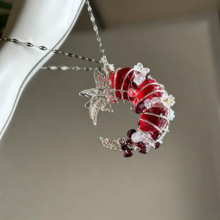Collana con ciondolo a mezzaluna in cristallo Olivenorma e dettagli a farfalla e stella. - image 2