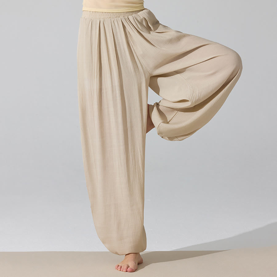 Pantaloni da yoga da donna Olivenorma a vita alta con elastico in vita e texture stropicciata, modello harem ampio. - image 0