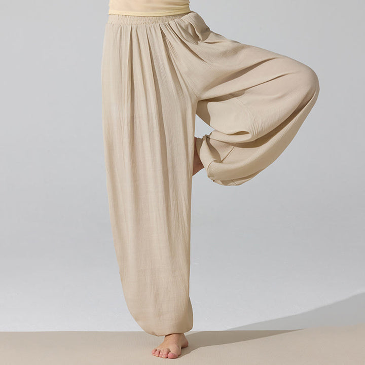 Pantaloni da yoga da donna Olivenorma a vita alta con elastico in vita e texture stropicciata, modello harem ampio. - image 0