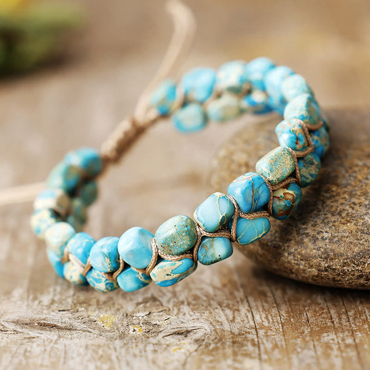 Bracciale Olivenorma con pietra imperatore, perline boeme e simbolo di benedizione intrecciate. - Blu turchese - image 0