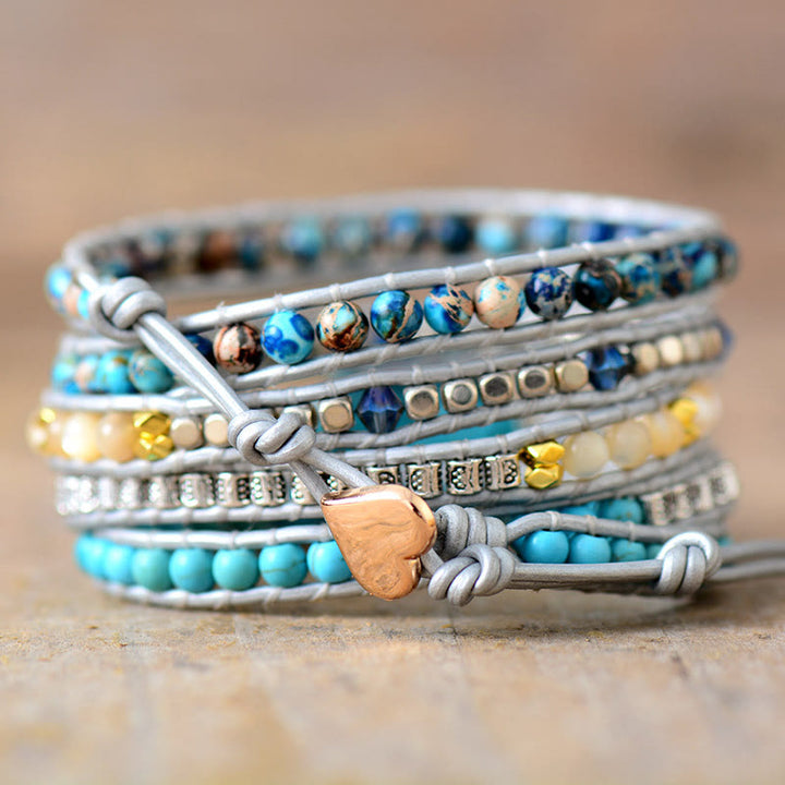 Bracciale Olivenorma con 5 maglie avvolte in pelle turchese e simbolo spirituale, lavorato a mano. - image 1