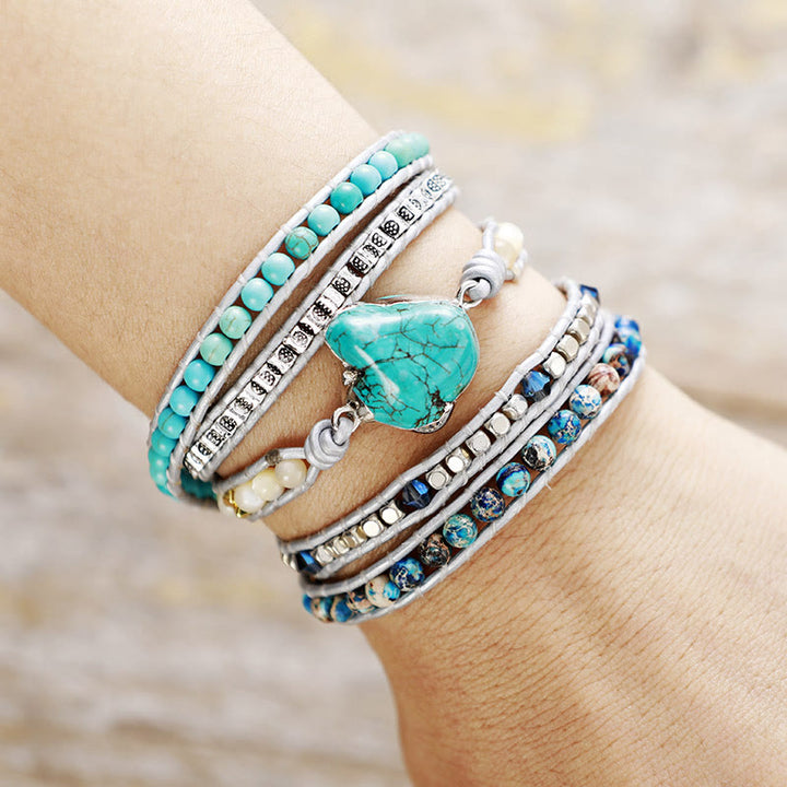 Bracciale Olivenorma con 5 maglie avvolte in pelle turchese e simbolo spirituale, lavorato a mano. - image 2