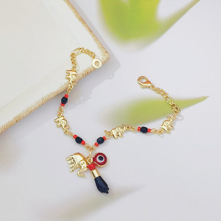 Bracciale Olivenorma con ciondolo a forma di occhio di Allah in perline di rame e simbolo di protezione. - image 3