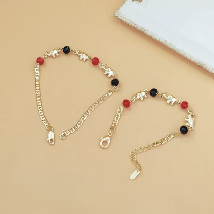Bracciale Olivenorma in rame con ciondolo a più elefanti, simbolo di benedizione. - image 4