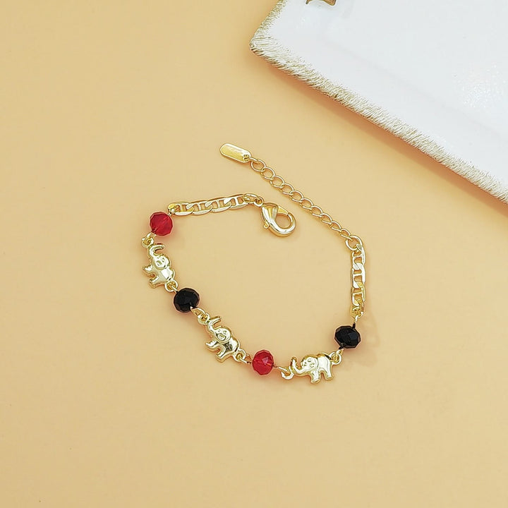 Bracciale Olivenorma in rame con ciondolo a più elefanti, simbolo di benedizione. - Bambini - image 2