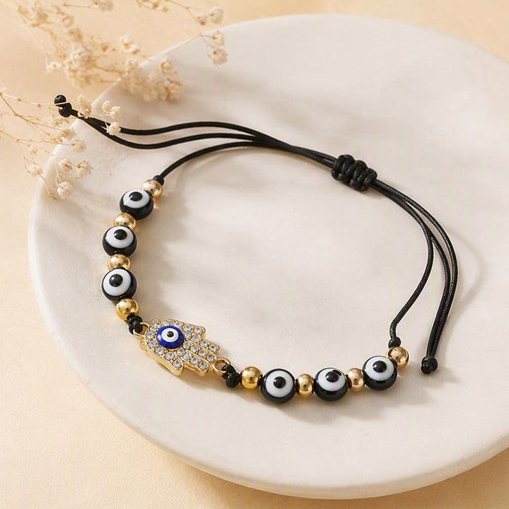 Bracciale Olivenorma in rame con ciondolo a forma multipla di occhio di Allah e simbolo di protezione. - image 4