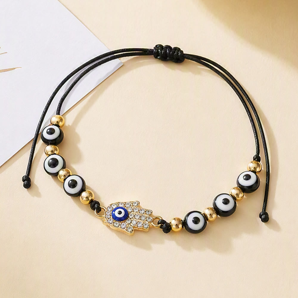 Bracciale Olivenorma in rame con ciondolo a forma multipla di occhio di Allah e simbolo di protezione. - image 3