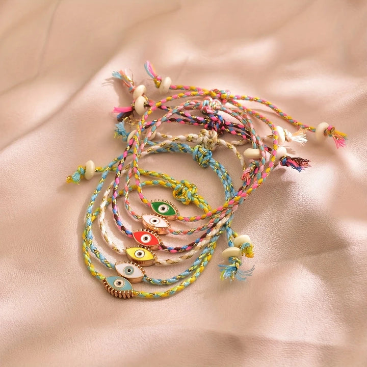 Bracciale Olivenorma in lega con nappa colorata a forma di occhio di Allah e simbolo di benedizione. - image 1