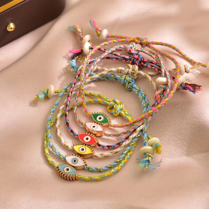 Bracciale Olivenorma in lega con nappa colorata a forma di occhio di Allah e simbolo di benedizione. - image 3