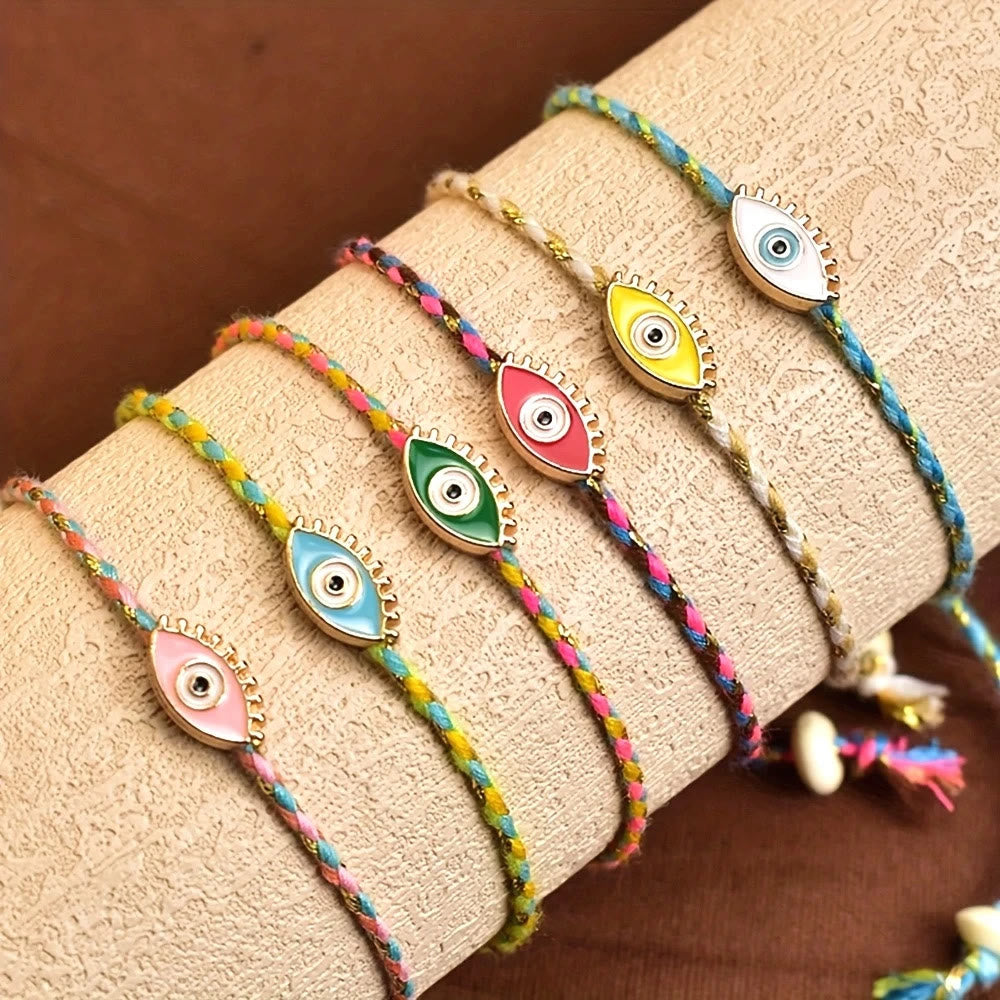 Bracciale Olivenorma in lega con nappa colorata a forma di occhio di Allah e simbolo di benedizione. - image 0