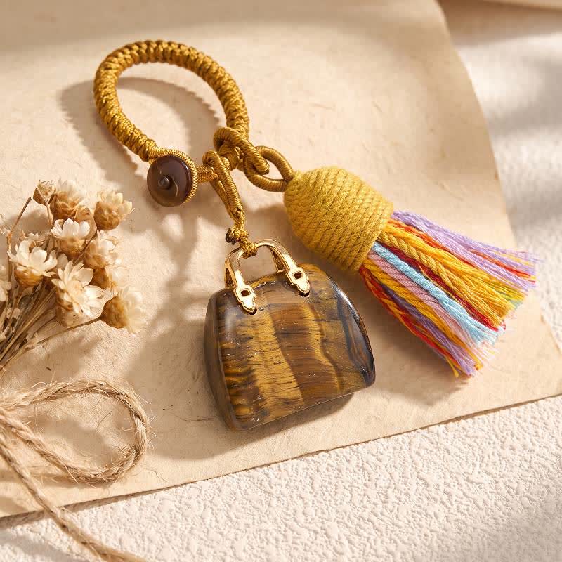 Portachiavi Olivenorma con nappa intrecciata a forma di borsa in cristallo naturale, portafortuna per la prosperità. - Occhio di tigre - image 1