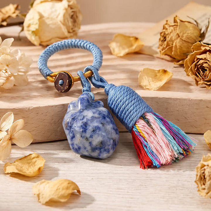 Portachiavi Olivenorma con nappa a forma di cuore anatomico in cristallo naturale, intrecciata a mano, simbolo di affetto e benedizione. - Diaspro maculato blu - image 17