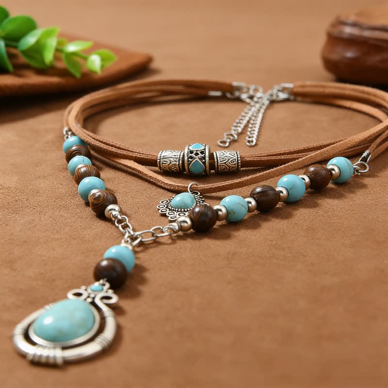 Collana a strati Olivenorma con turchese, design e simbolo di protezione spirituale. - image 7