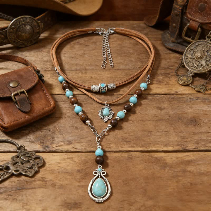 Collana a strati Olivenorma con turchese, design e simbolo di protezione spirituale. - Turchese - image 0