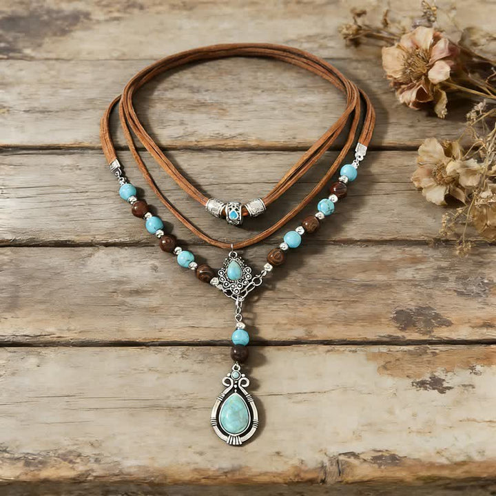 Collana a strati Olivenorma con turchese, design e simbolo di protezione spirituale. - image 10