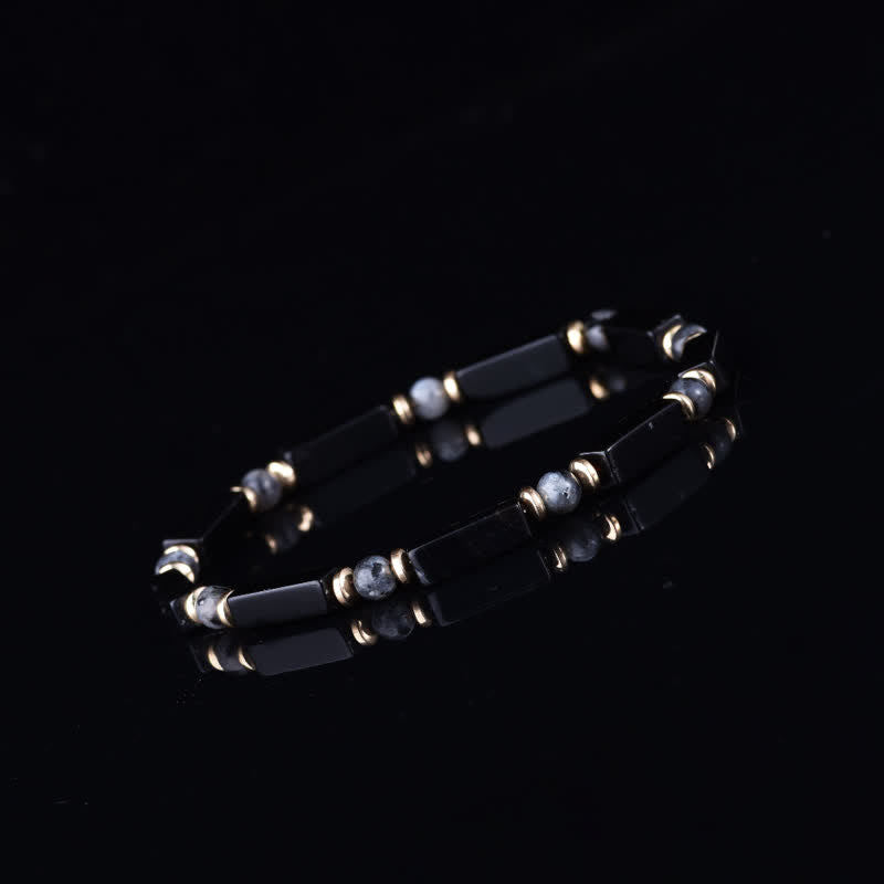 Bracciale Olivenorma con perline in pietra naturale e simbolo di protezione e resistenza. - image 2