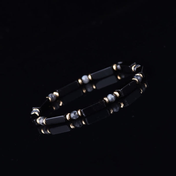 Bracciale Olivenorma con perline in pietra naturale e simbolo di protezione e resistenza. - image 2