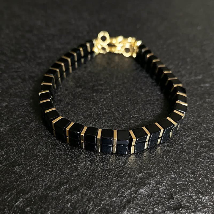 Bracciale Olivenorma con perline in pietra naturale e simbolo di protezione e resistenza. - Ossidiana - image 16