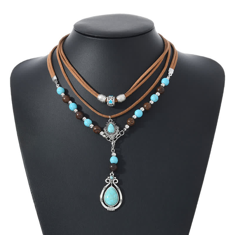 Collana a strati Olivenorma con turchese, design e simbolo di protezione spirituale. - image 11