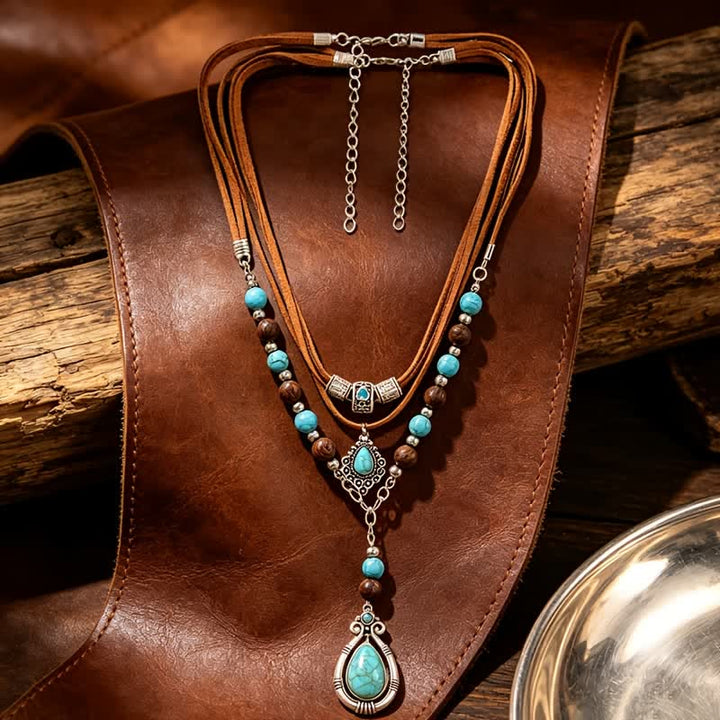 Collana a strati Olivenorma con turchese, design e simbolo di protezione spirituale. - image 8