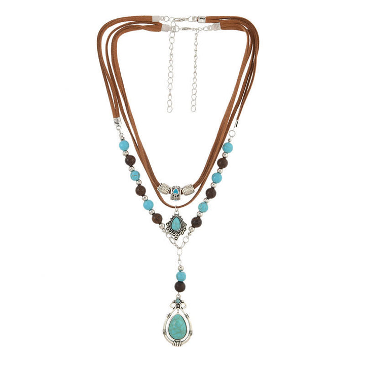 Collana a strati Olivenorma con turchese, design e simbolo di protezione spirituale. - image 12