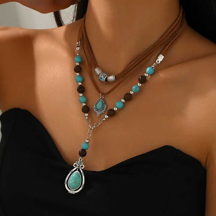 Collana a strati Olivenorma con turchese, design e simbolo di protezione spirituale. - image 3