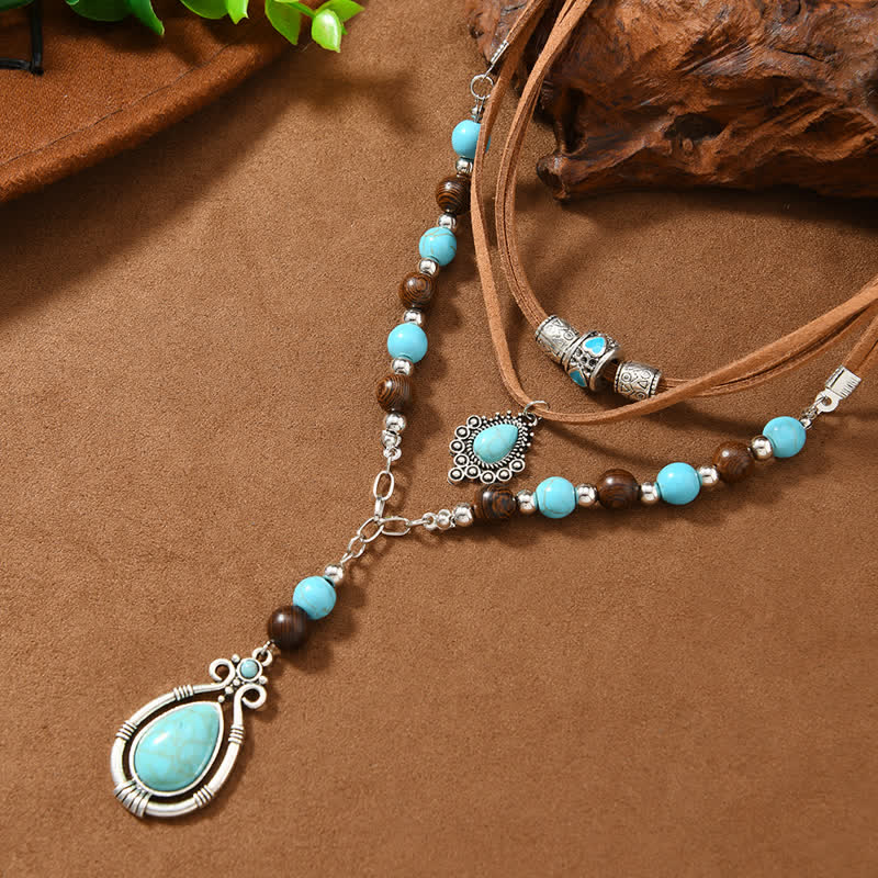 Collana a strati Olivenorma con turchese, design e simbolo di protezione spirituale. - image 5
