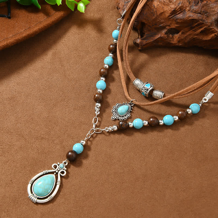 Collana a strati Olivenorma con turchese, design e simbolo di protezione spirituale. - image 5