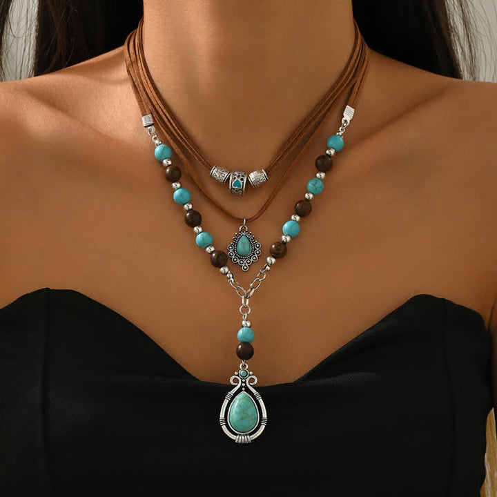 Collana a strati Olivenorma con turchese, design e simbolo di protezione spirituale. - image 2