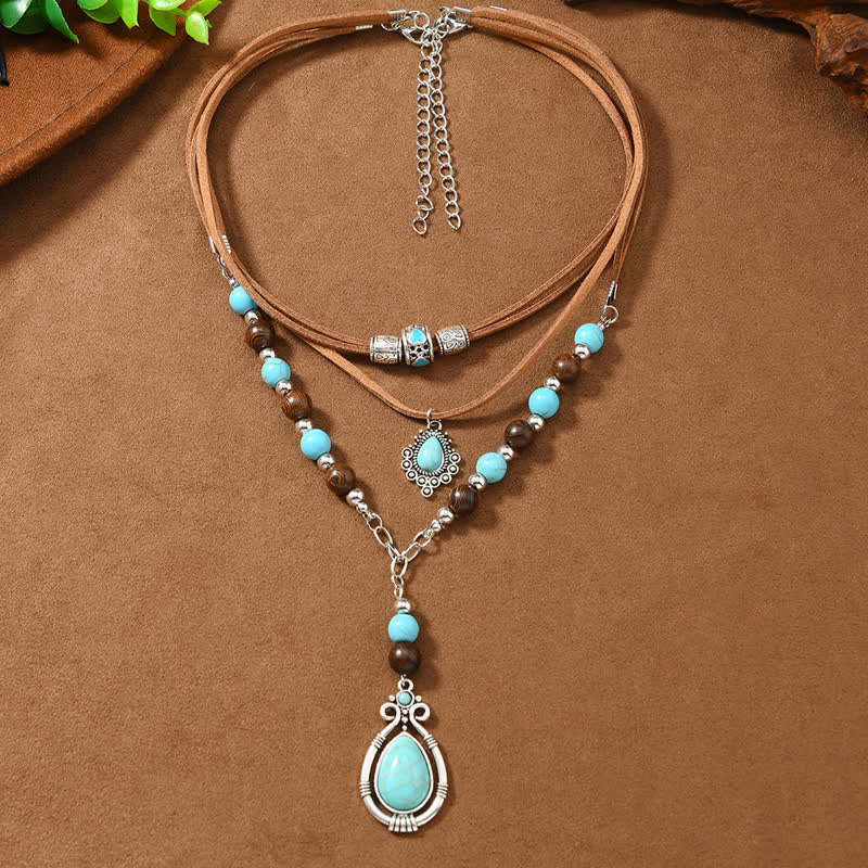 Collana a strati Olivenorma con turchese, design e simbolo di protezione spirituale. - image 4