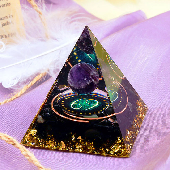 Sfera di ametista Olivenorma con piramide di orgone dello zodiaco Cancro in ossidiana 
