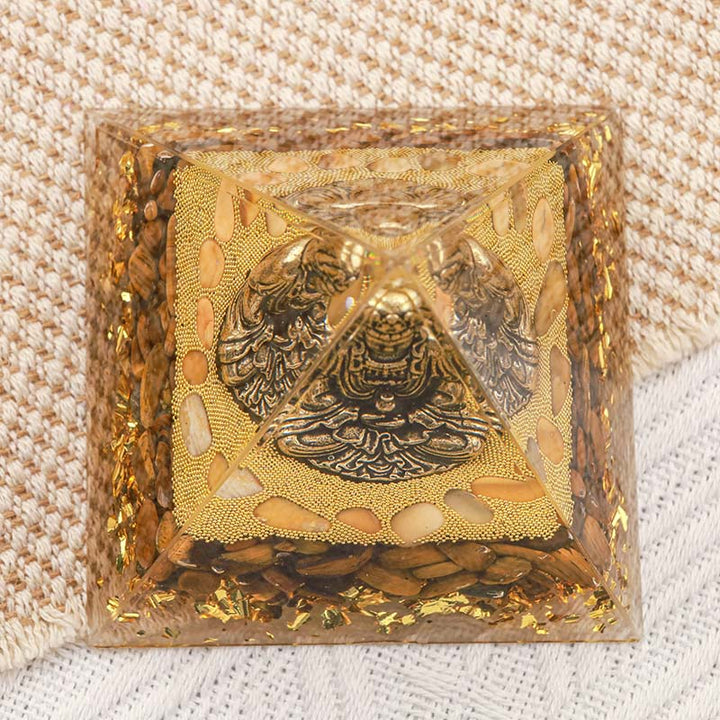 Buddha Olivenorma con piramide di orgone con protezione dell'occhio di tigre