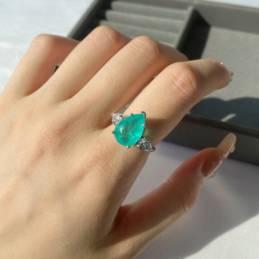 Anello squisito con tormalina Paraiba Olivenorma e zircone bianco