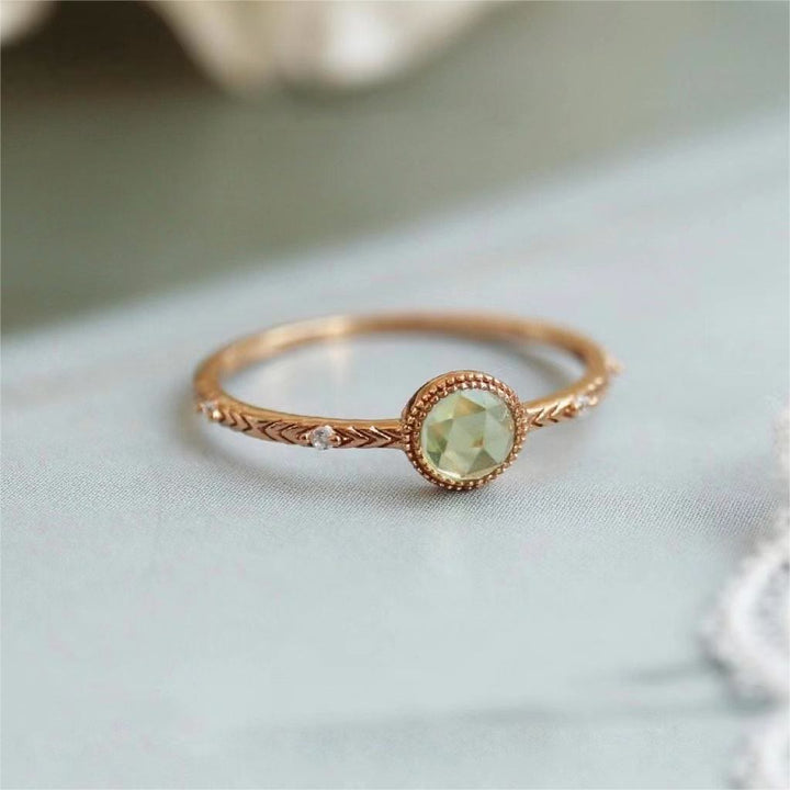 Anello Olivenorma con peridoto verde taglio rotondo naturale