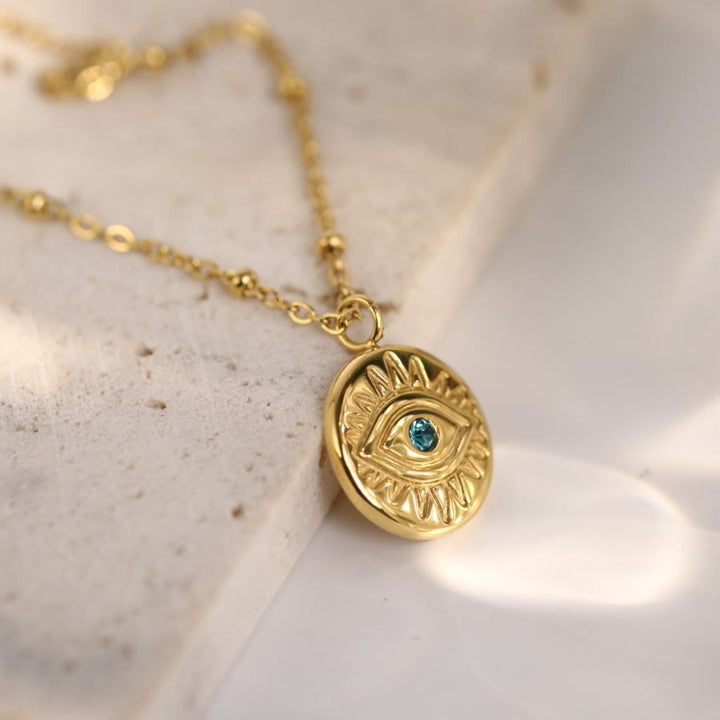 Collana in acciaio al titanio 316L con topazio blu e malocchio Olivenorma 