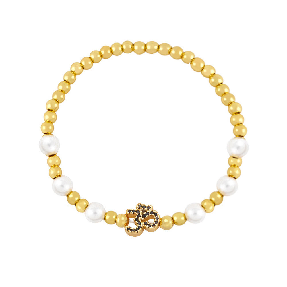 Bracciale Olivenorma in ottone con perle e simbolo Om