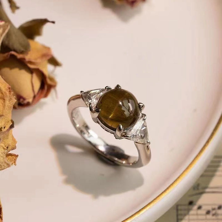 Anello Olivenorma con pietra occhio di gatto verde dorato a quattro artigli