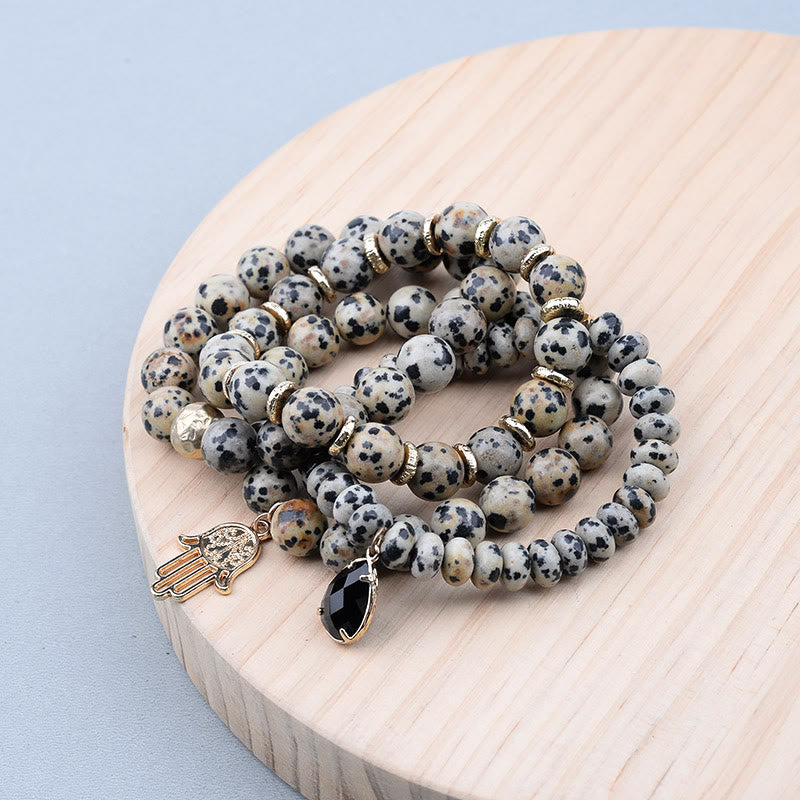 Olivenorma Bracciale con ciondolo Hamsa in ossidiana diaspro dalmata naturale