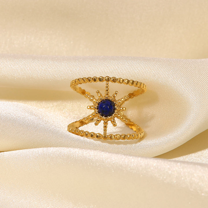 Anello con gemma a forma di stella a otto punte e doppia fila di girasole Olivenorma