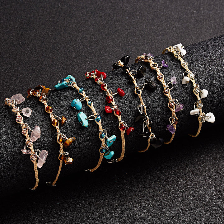 Bracciale intrecciato con ghiaia, nappa, ossidiana, occhio di tigre e ametista Olivenorma