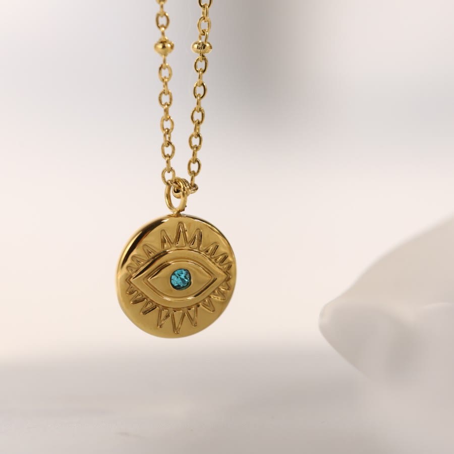 Collana in acciaio al titanio 316L con topazio blu e malocchio Olivenorma 