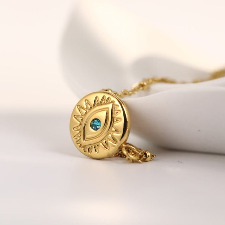 Collana in acciaio al titanio 316L con topazio blu e malocchio Olivenorma 