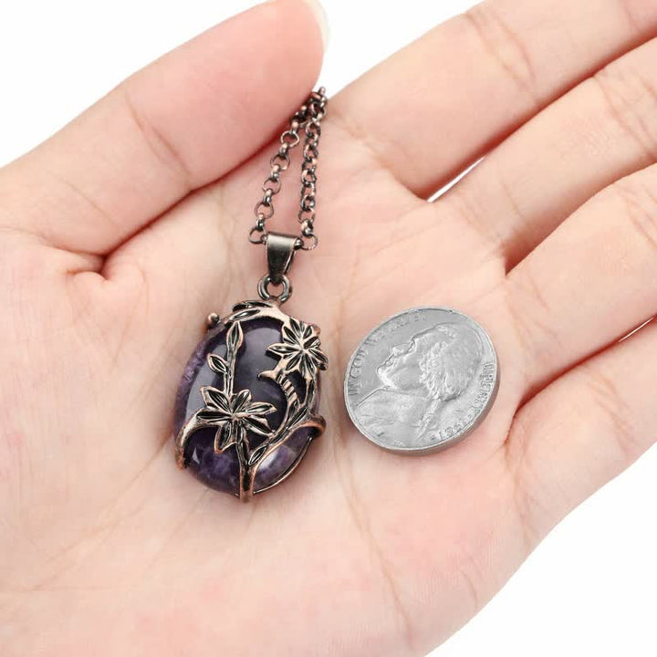 Collana con fiore in ottone e ametista Olivenorma avvolto in cristallo