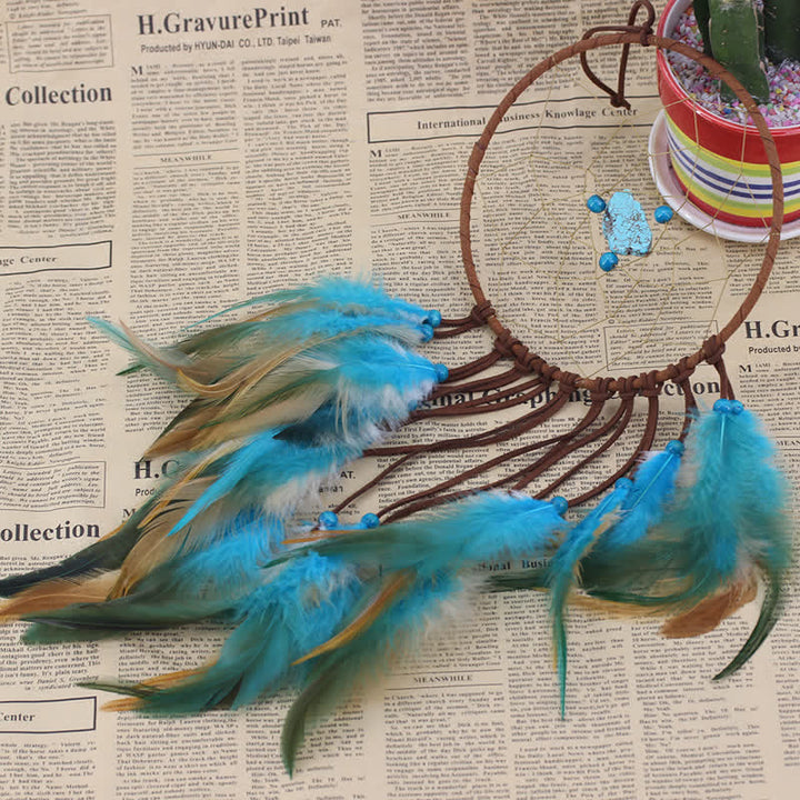 Olivenorma "Dream Knight" - Acchiappasogni con piume turchesi 