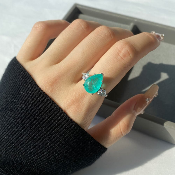 Anello squisito con tormalina Paraiba Olivenorma e zircone bianco