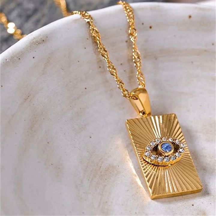 Collana con occhio maligno Olivenorma , topazio blu e zircone bianco 